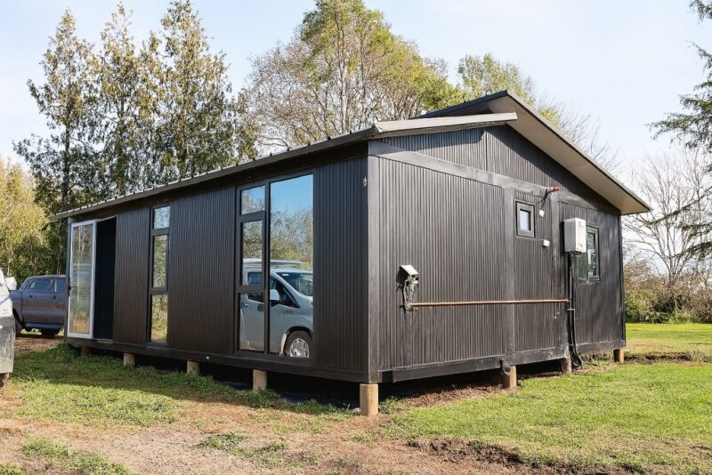 Black modern container home in New Zealand built by Portable Dwellings